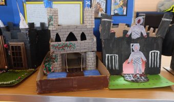 photo of model castles made with cardboard and paint. designed by children
