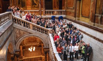 a photo of 50 plus people standing on a large stone staircase